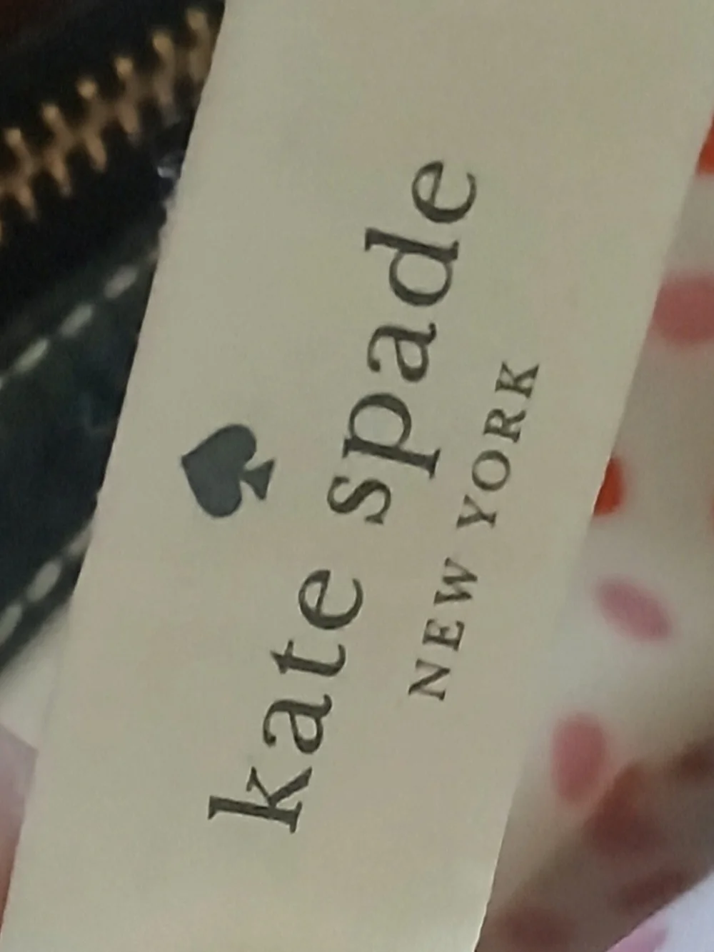 kate spade black leather satchel with polka-dot interior